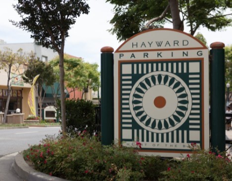 Downtown Hayward parking sign reading Heart of the Bay, in the district Ontrack Moving crews work daily
