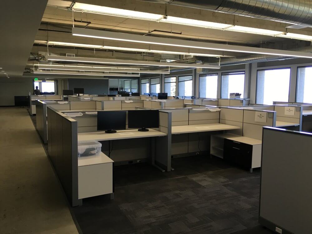 Ontrack Moving crew reconfiguring office cubicles during a Tempe business relocation