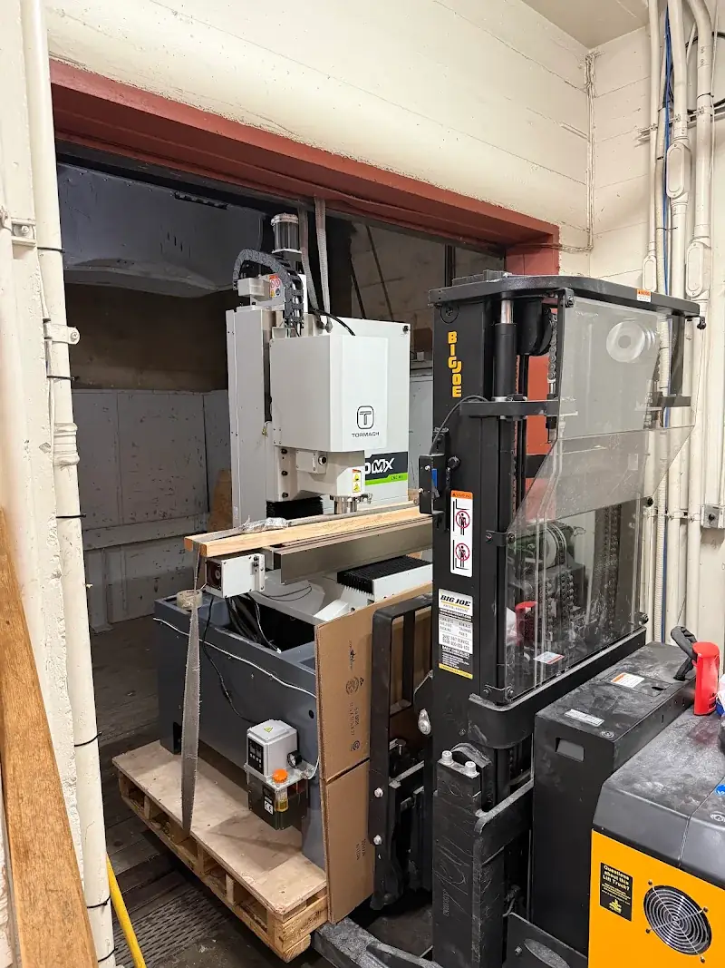 Palletized and strapped Tormach 1100MX CNC mill inside a San Francisco building freight elevator