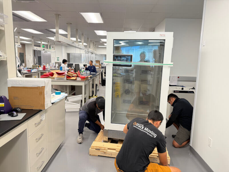 Ontrack Moving crew relocating rack-mounted lab equipment at a Sunnyvale research facility