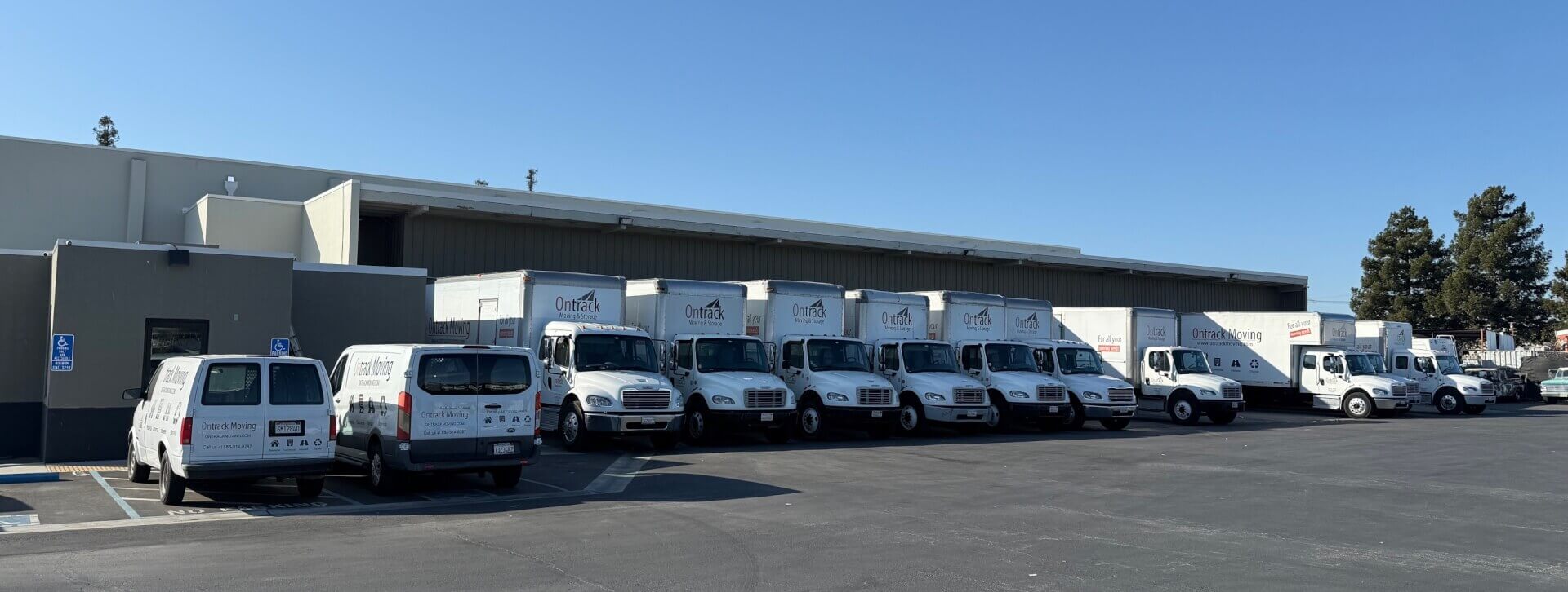 Long-distance interstate movers from Ontrack Moving with carrier trucks ready for California to Arizona relocation
